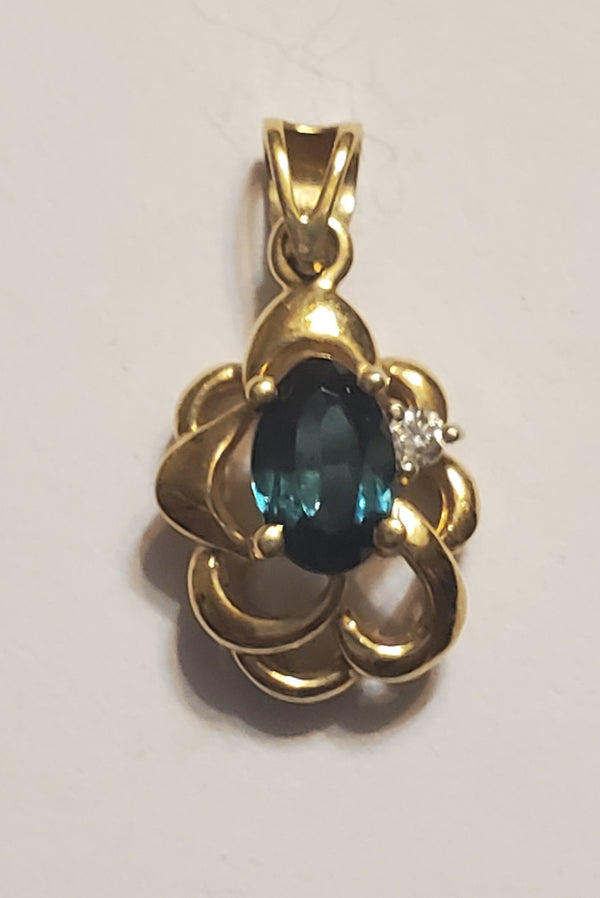 14k Gold charm with stone