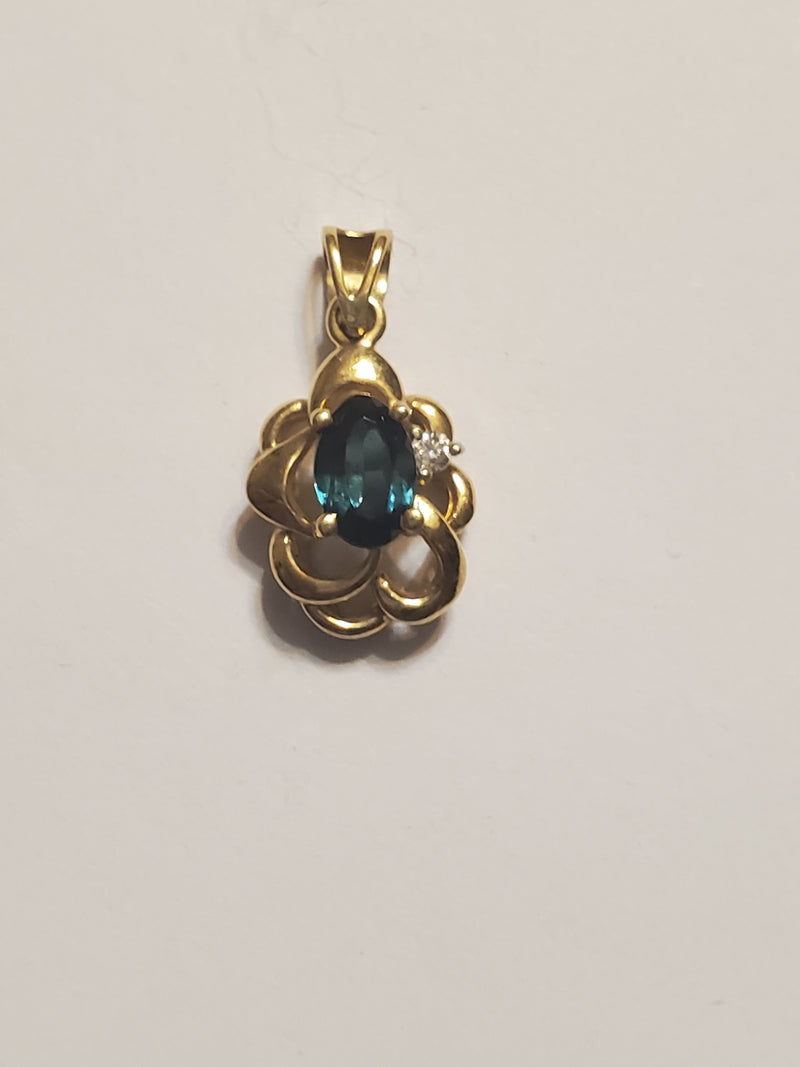 14k Gold charm with stone